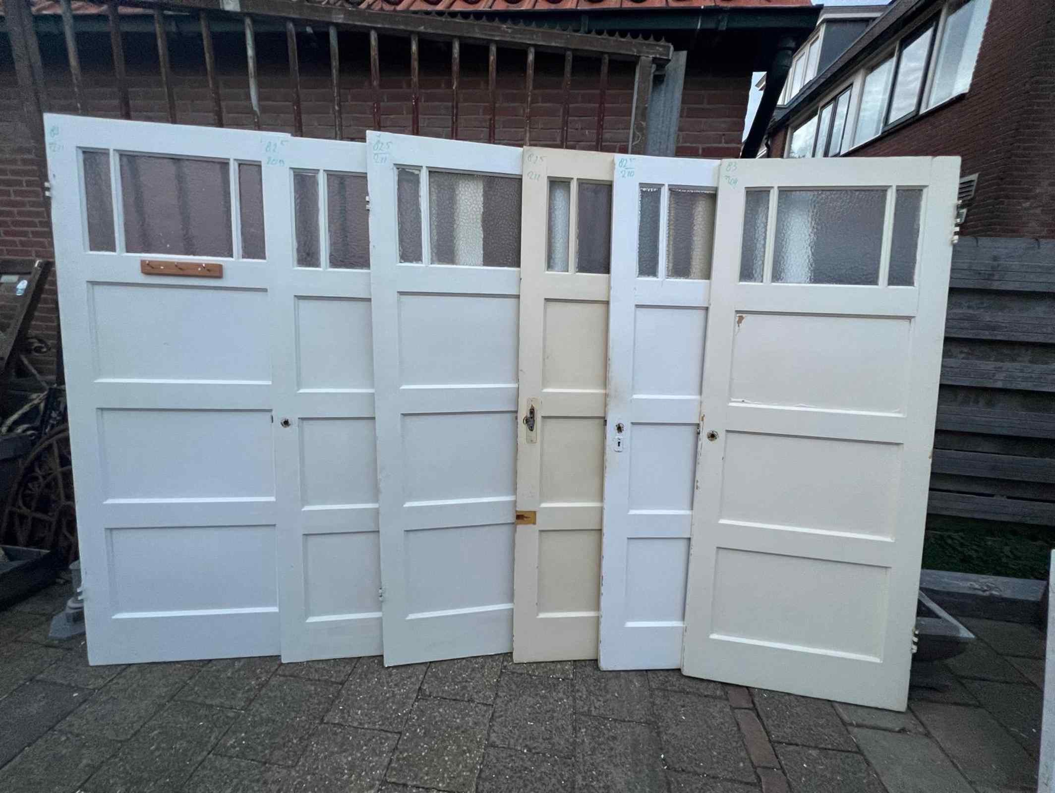 4 vak paneeldeuren met gedeelde ruit